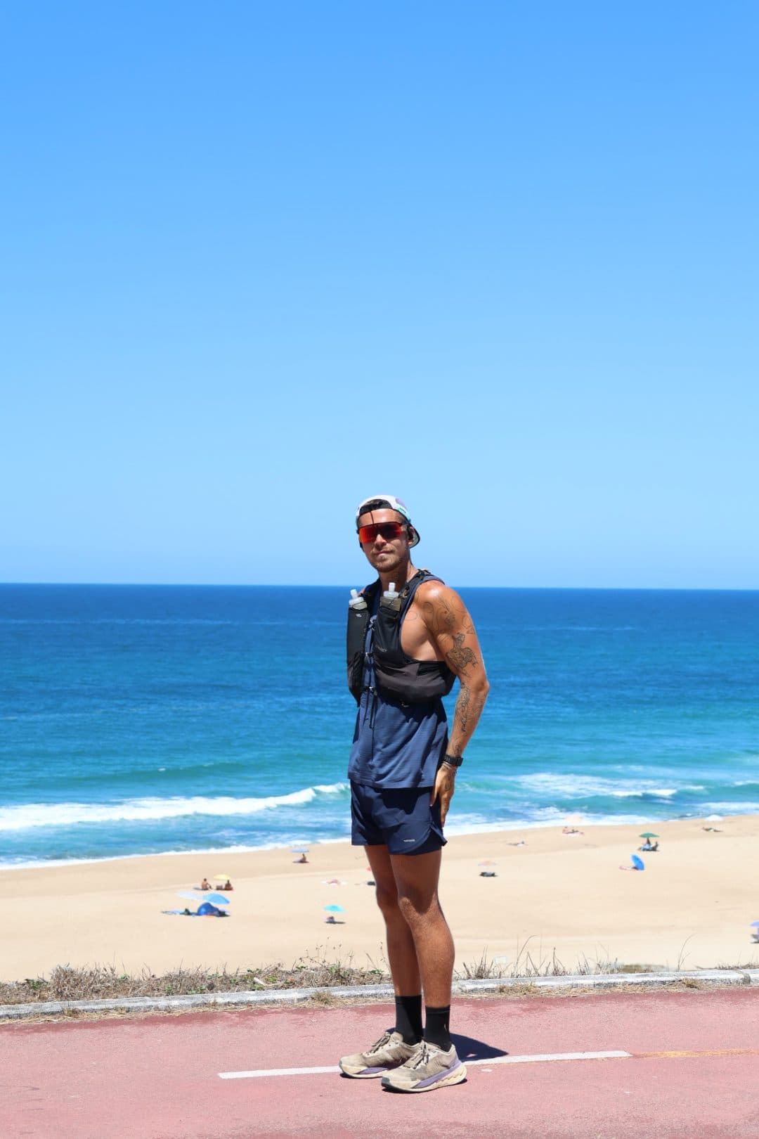 Jonathan Fors standing on a coastal path above a beach, the Atlantic behind him.