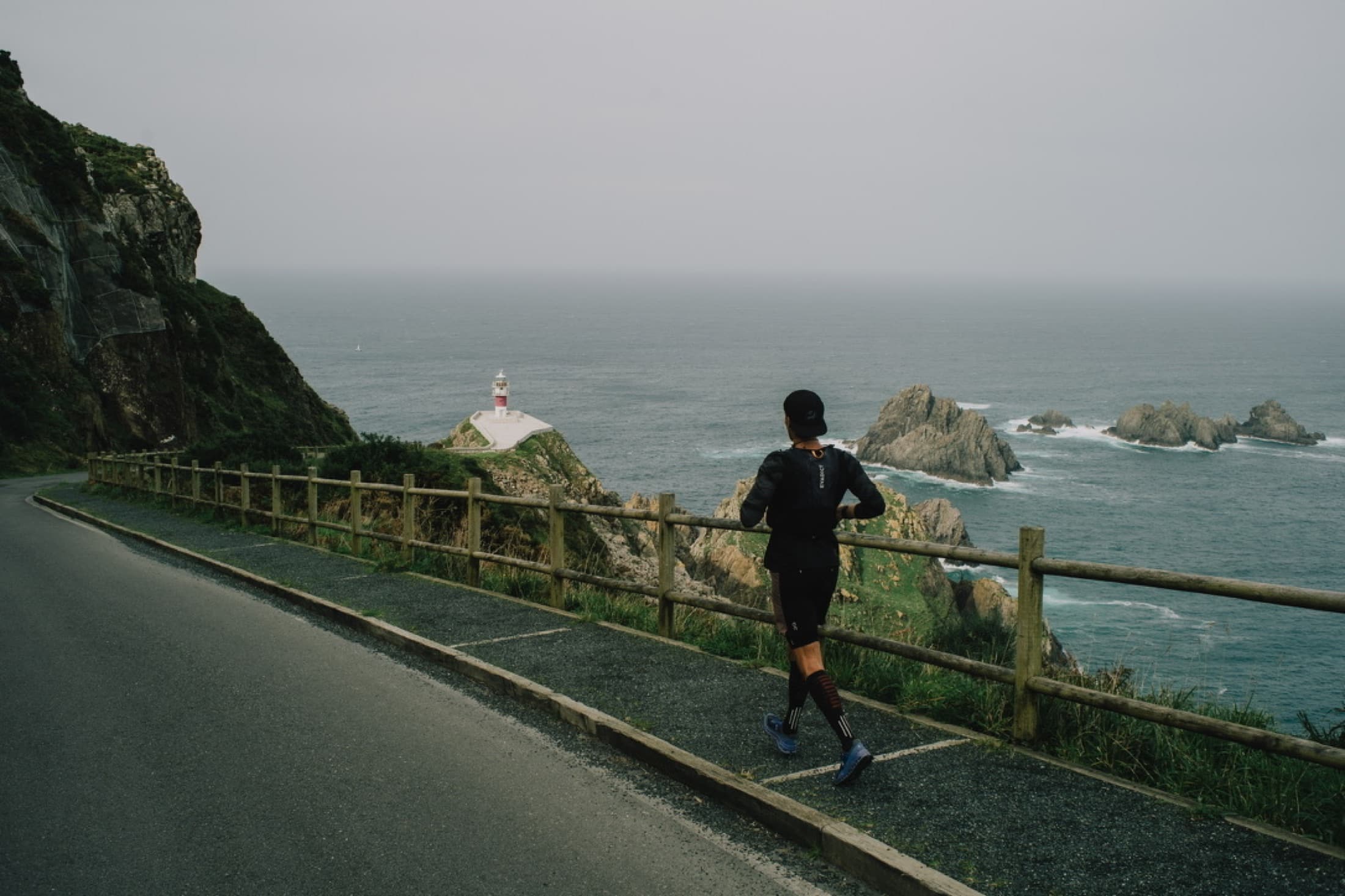 An empty road tracing the cliffs above the Atlantic — the support route.